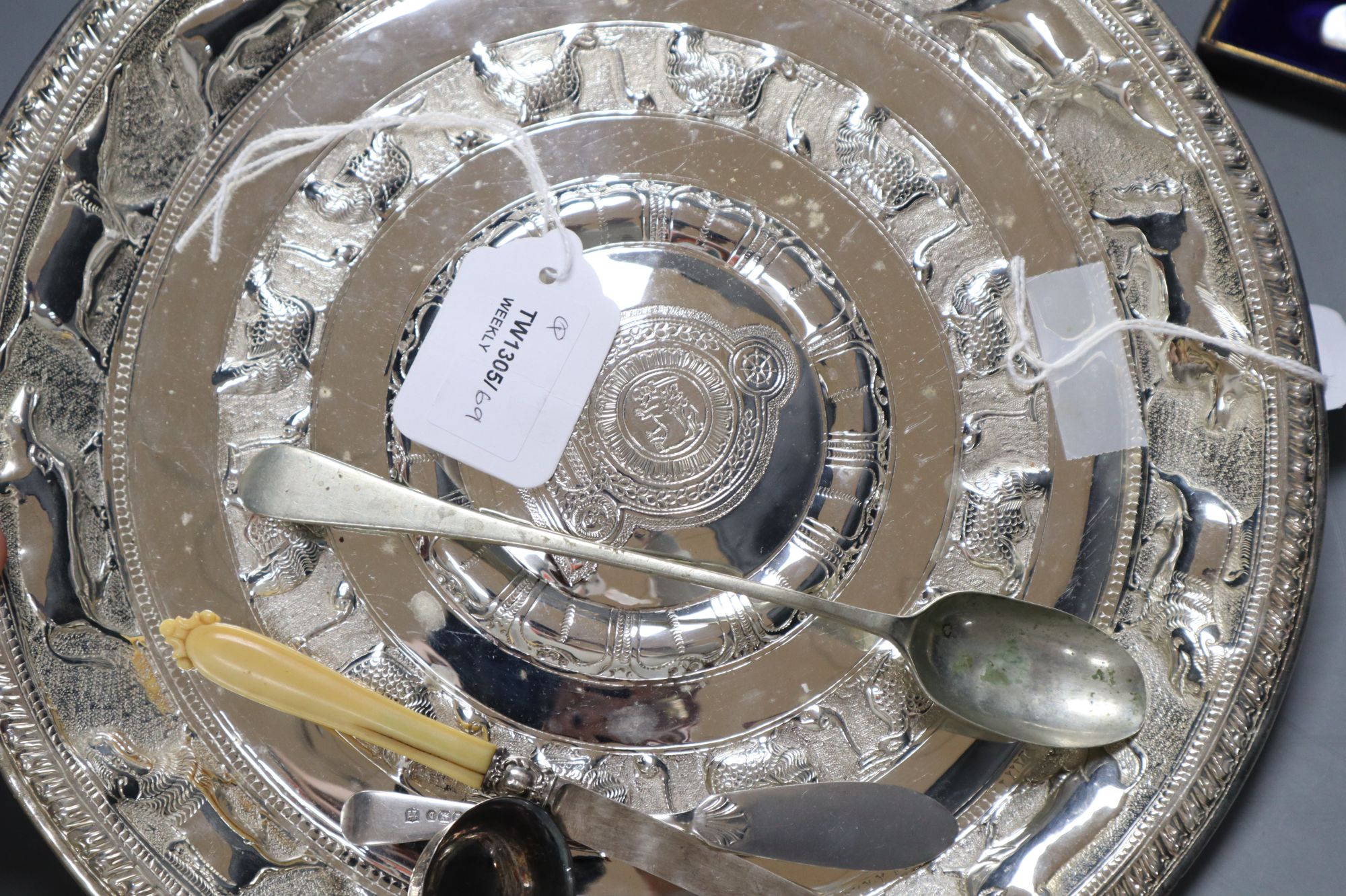 An Eastern embossed plated tray, a cased plated nut and grape set, a plated coffee pot, a silver sauce ladle and sundries